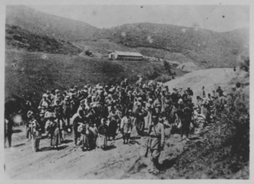 Ottoman troops guard Armenians being deported. Ottoman Empire, 1915-1916.