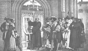 Martin Luther nails the 95 Theses on the church door at Wittenberg.
